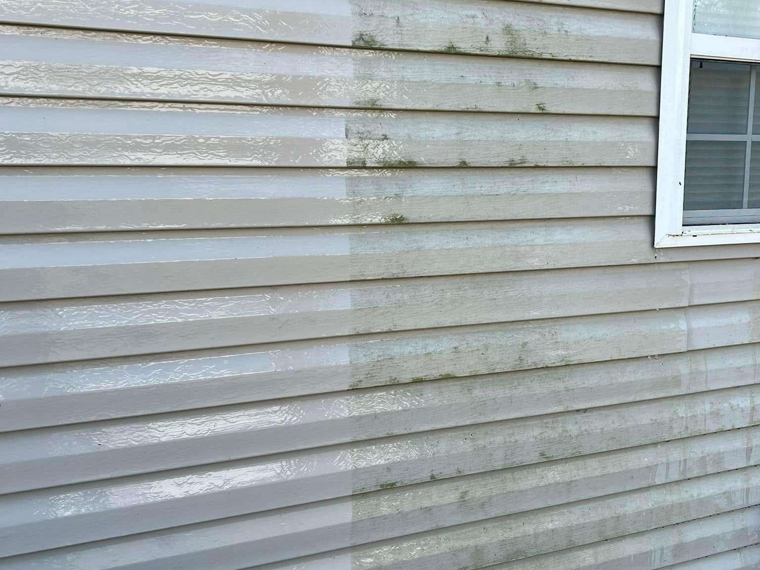 Before and after image of power washed vinyl siding with visible results