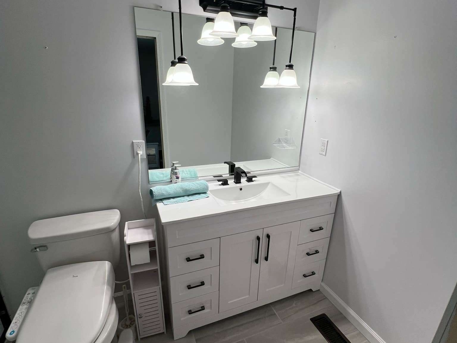 Bathroom remodel showing updated fixtures and clean finish