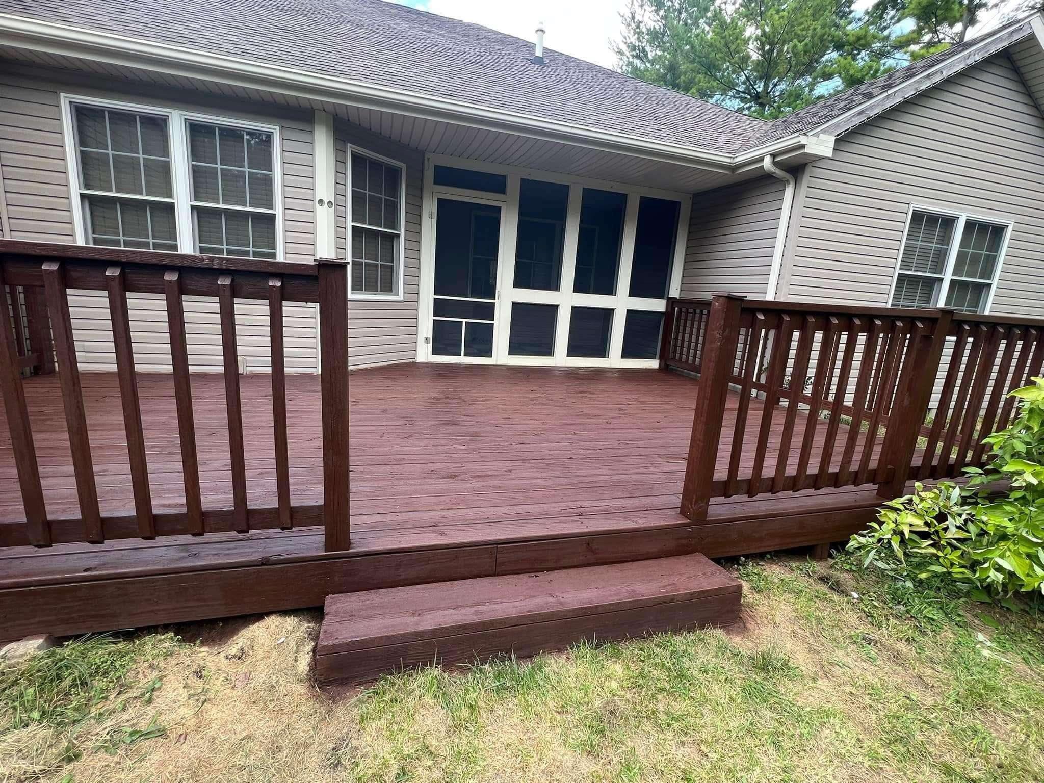 Refinished wooden deck and back porch after power washing and staining