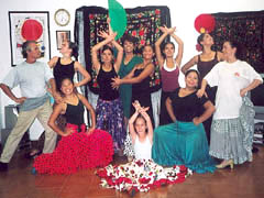 Flamenco class groups Barcelona with flamenco dancers traditional Flamenco dresses all participants