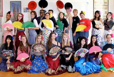 Flamenco class customized for groups of all levels with traditional Flamenco dresses in Barcelona, Spain