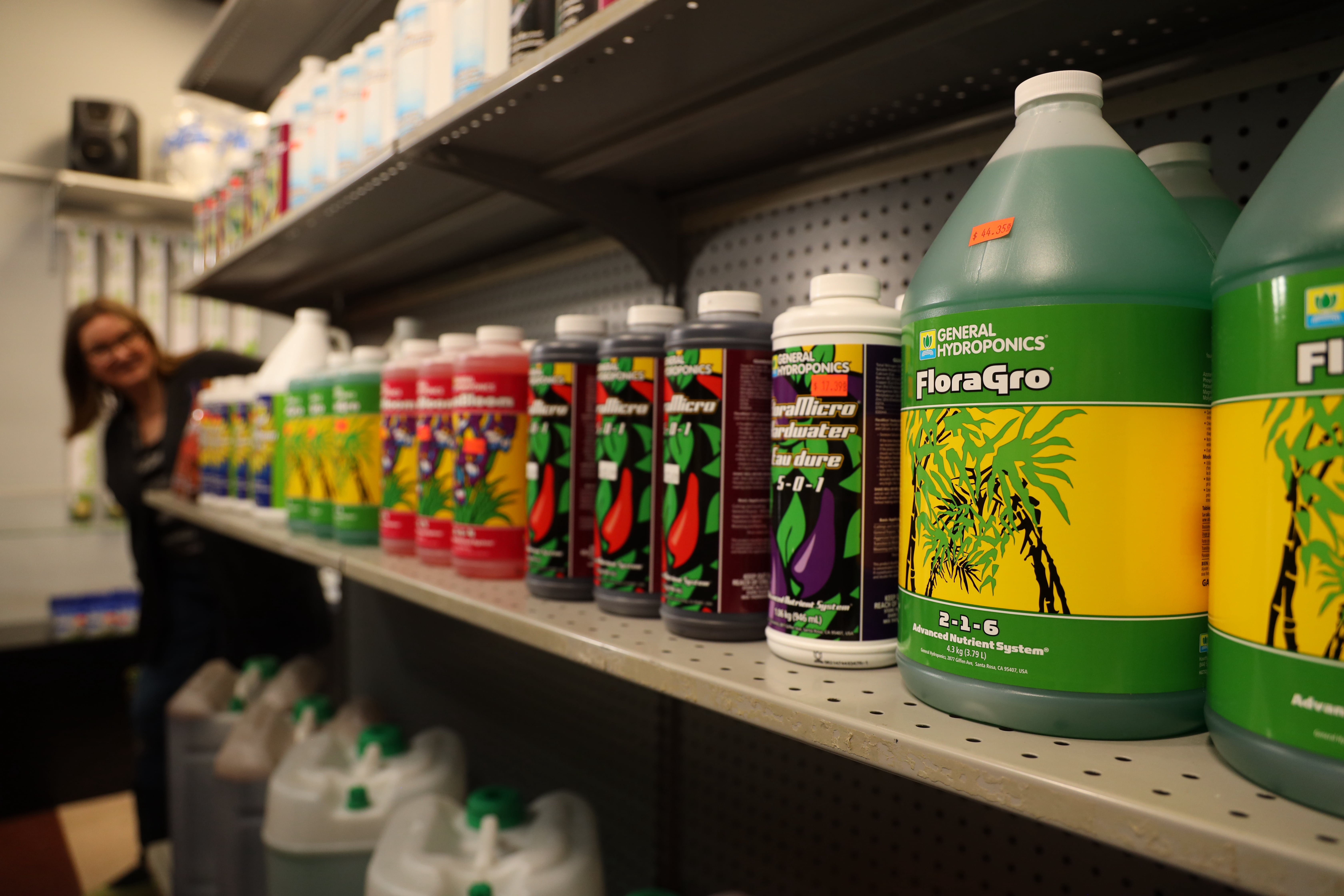 Jackie standing at the end of the General Hydroponics Isle.