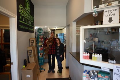 Jackie & Chris standing beside the kiosk