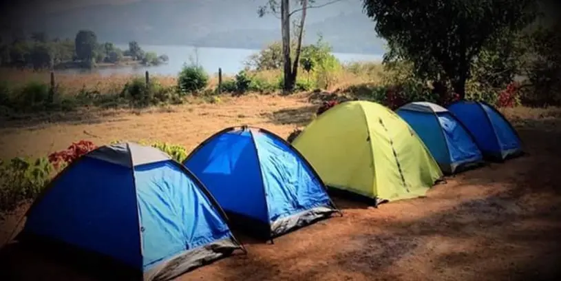 Camping at Tapola in Mahabaleshwar: Enjoy scenic lakeside tents and adventure activities amidst lush greenery.