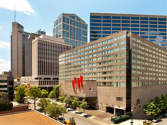 Nashville skyline with Doubletree by Hilton, host of AIMSVAR 2025 conference in foreground.